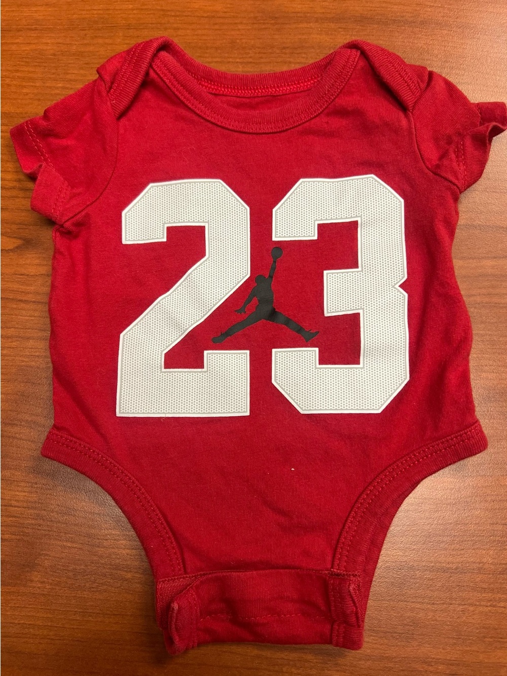 Jordan Red Newborn Bodysuit with White Accents
